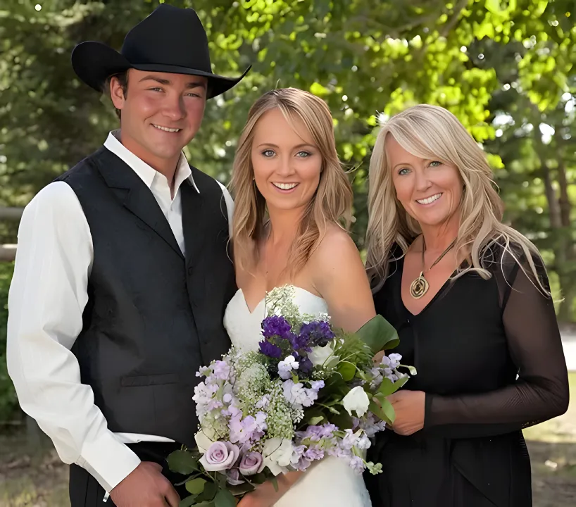 Amber Marshall and Shawn Turner on their wedding day, smiling and holding hands.